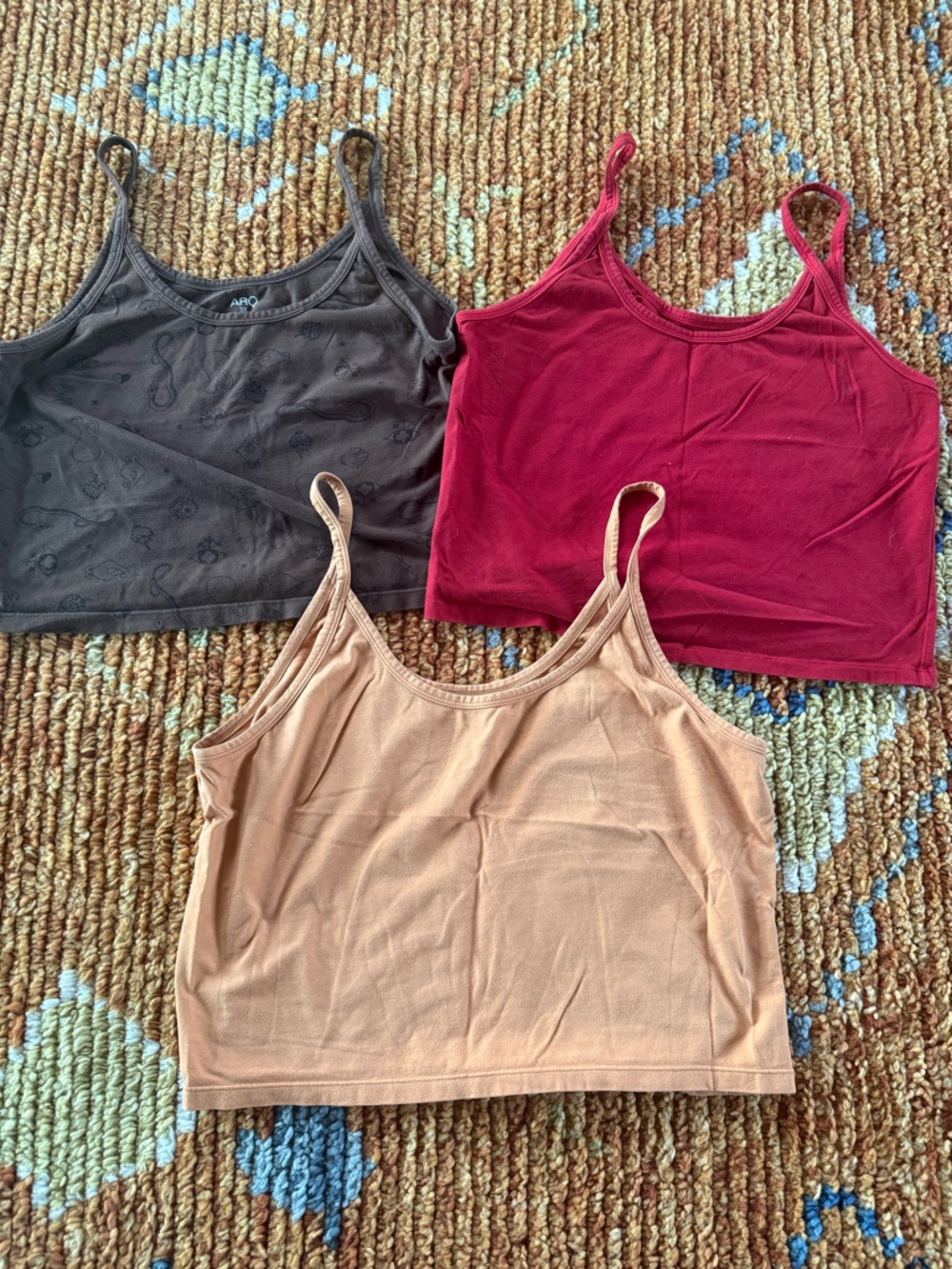 ARQ Women’s Camisole Set in Orange, red, and brown with black symbols